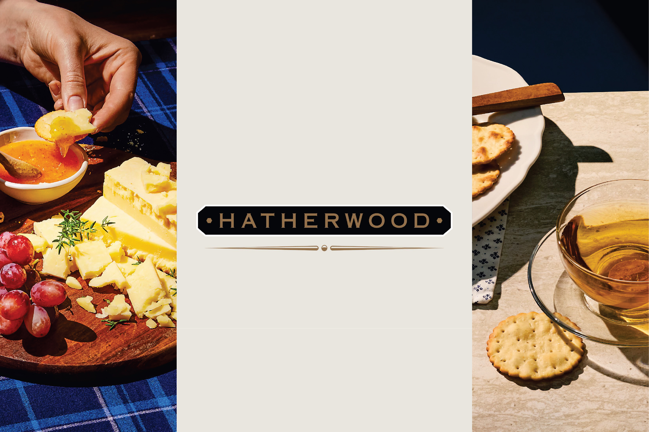 Ръка потапя бисквита в конфитюр, до сирене, грозде и чай, с надпис „HATHERWOOD“.